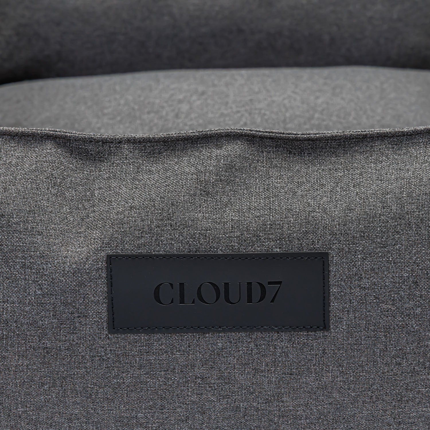 Gray fabric surface with a Cloud7 label