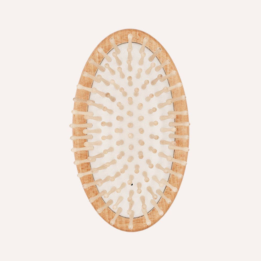 Rounded wooden pin massage brush for dogs suitable before or after bath time.