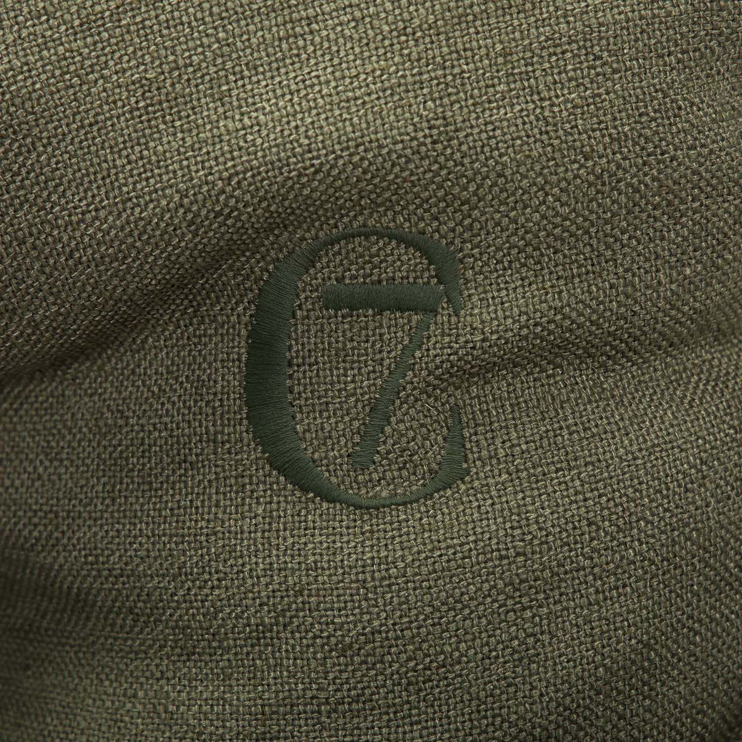 Close-up of a green fabric with a logo on it