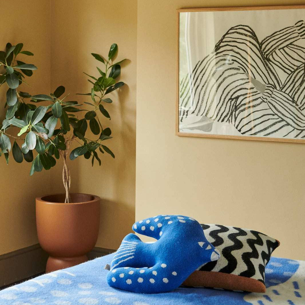 Designer knitted cushion made from 100% pure British wool.