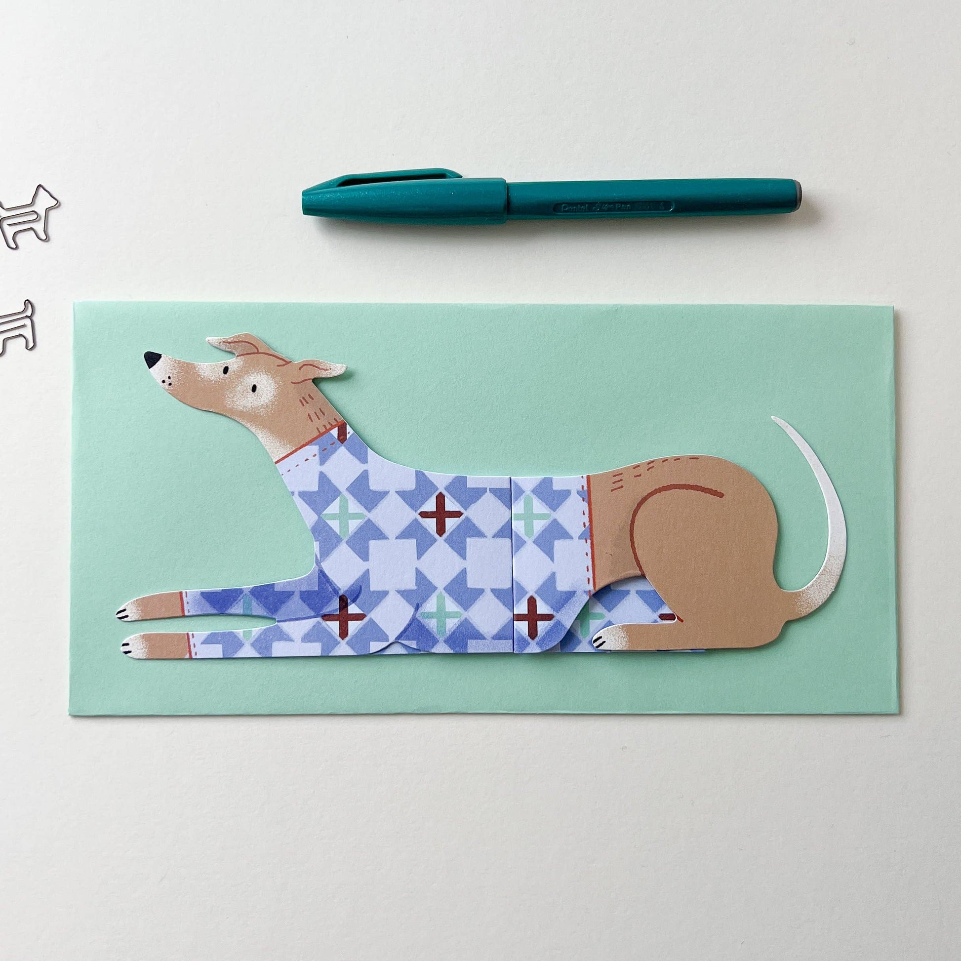 Notebook with a dog illustration on a light green background