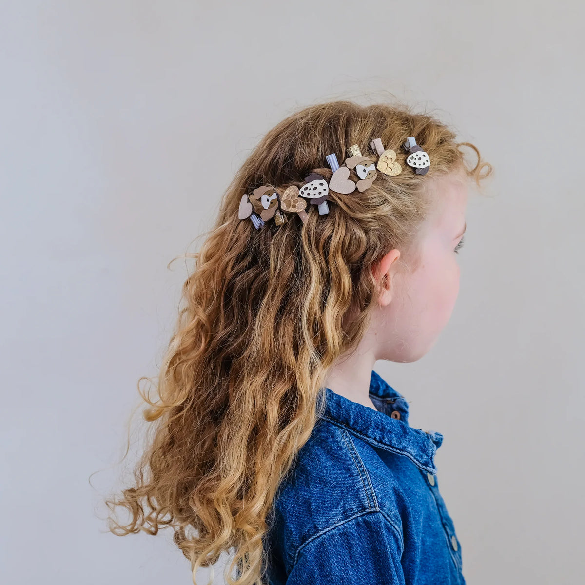 Set of eight Mimi & Lula puppy themed mini hair clips for children