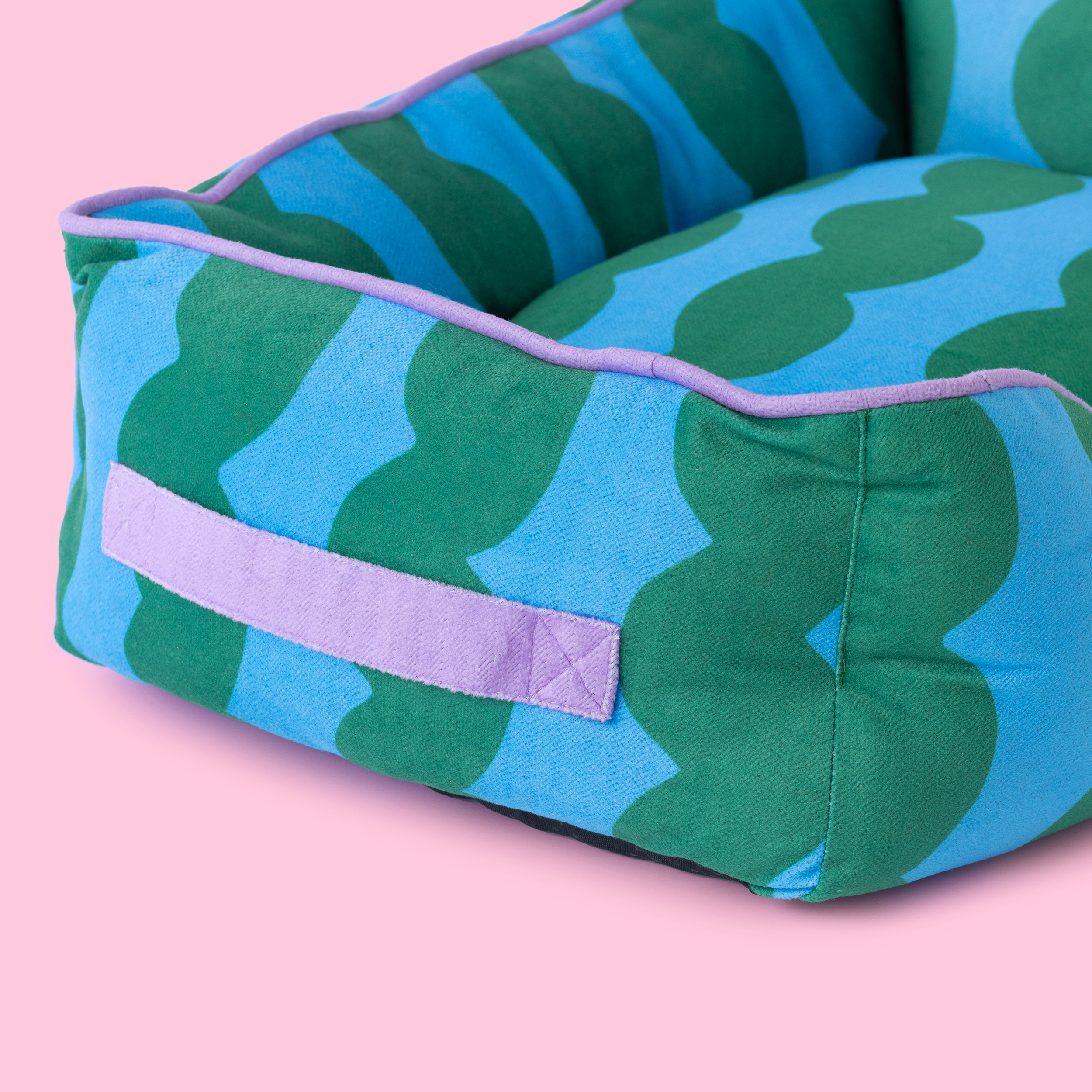 Luxury designer basket dog bed adding colour and comfort to contemporary interiors.