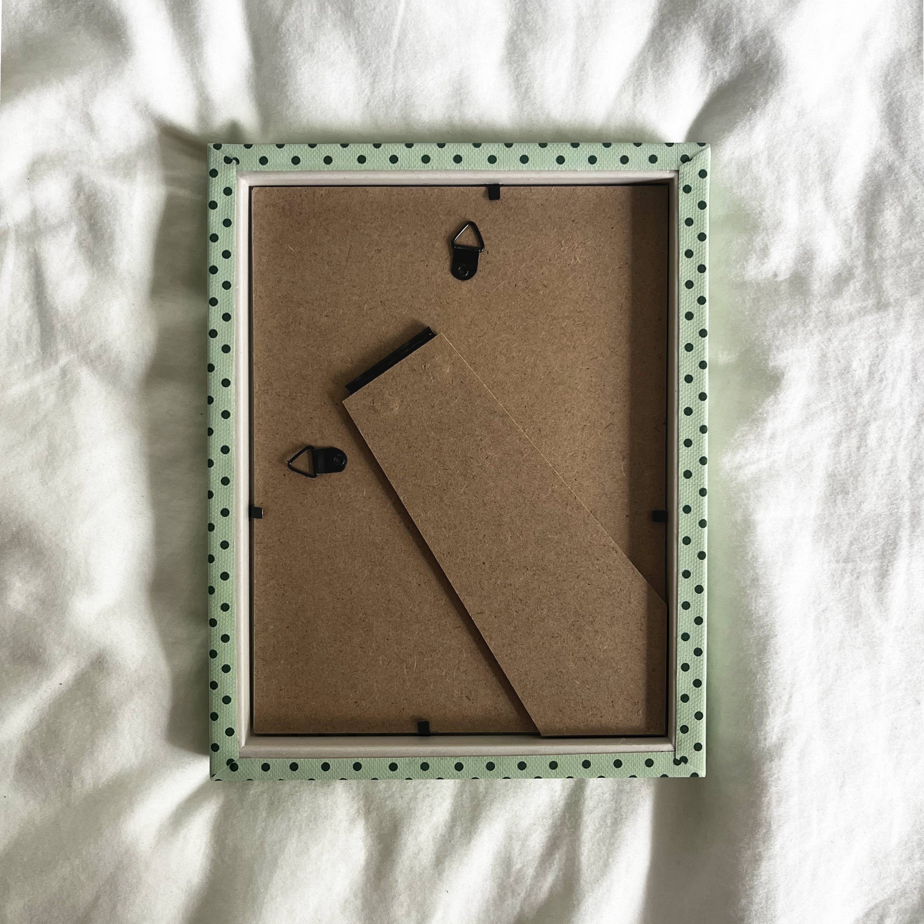 Contemporary cotton fabric-wrapped picture frame in mint green and emerald.