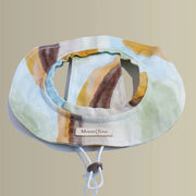 Moonrise Ochre Pet Bucket Hat featuring a classic plaid design, breathable cotton fabric and adjustable chin cord.