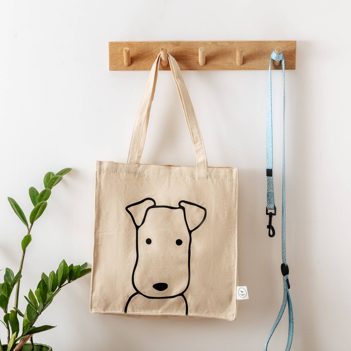Cream organic cotton canvas tote bag designed for dog lovers.