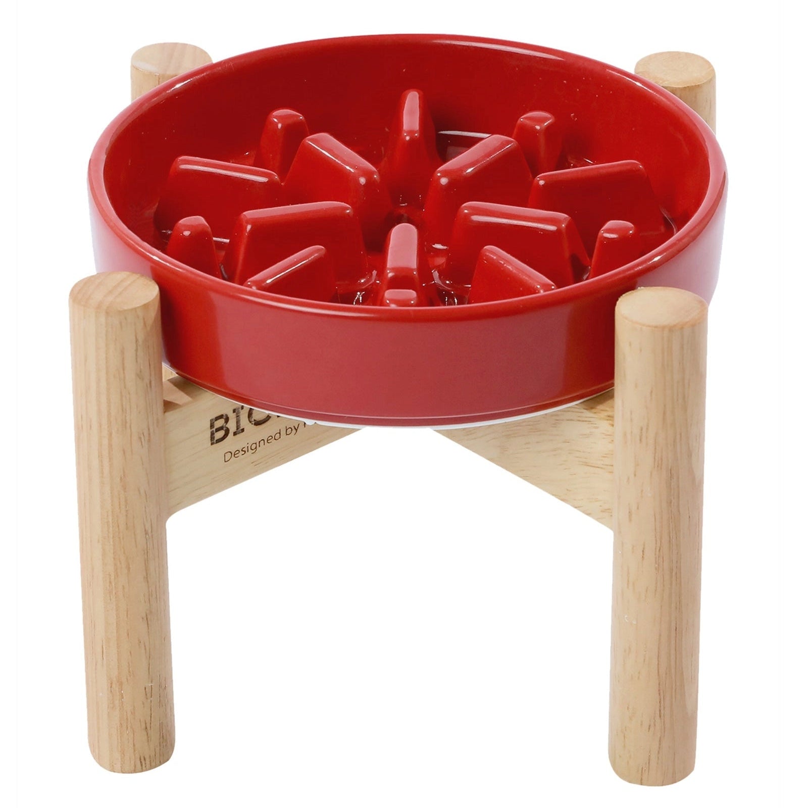 Red ceramic Pehom Spark slow feeder dog bowl with natural wooden stand for small dogs.