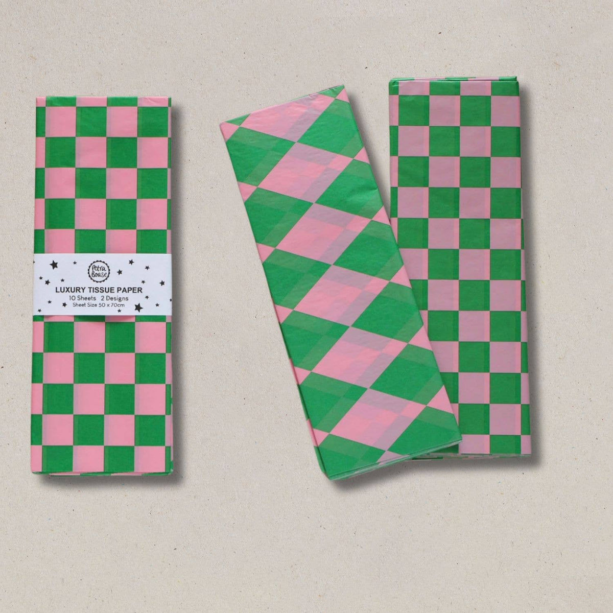 Petra Boase luxury patterned tissue paper in pink and green diamond and chequerboard designs.