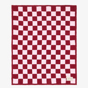 Pink checkerboard recycled microfleece throw blanket for colourful contemporary homes.