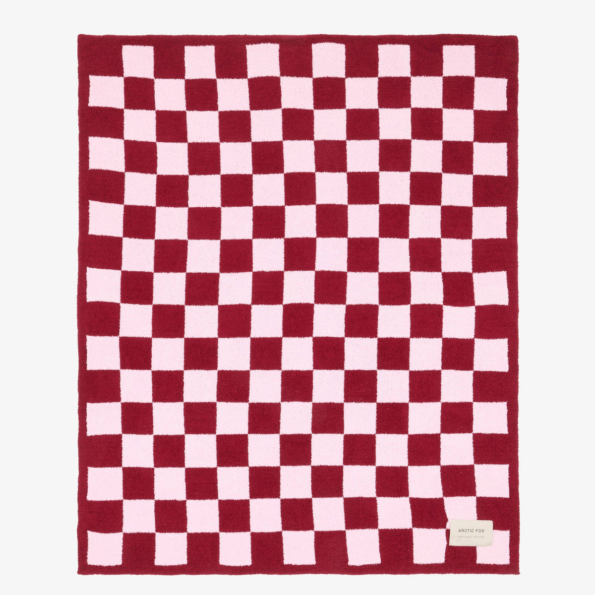 Pink checkerboard recycled microfleece throw blanket for colourful contemporary homes.