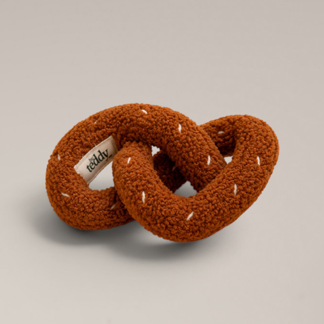 Pretzel dog toy with stimulating crinkle fabric