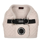 Beige quilted dog harness with black Puppia branding on a white background