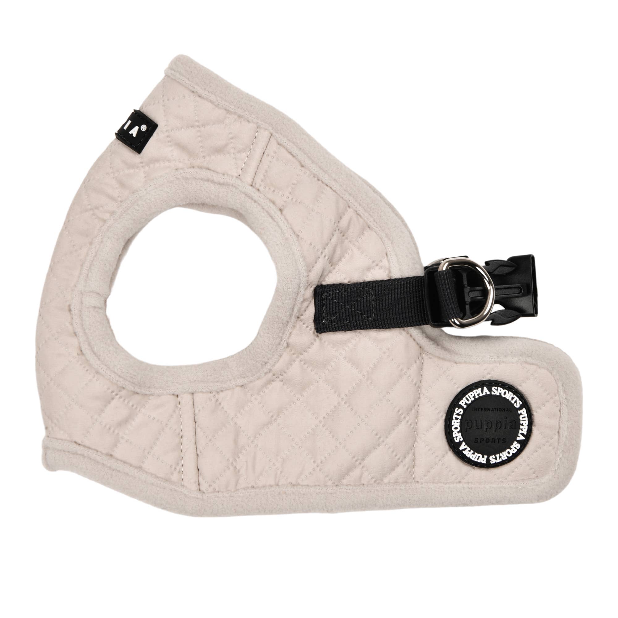 Beige quilted dog harness with a black buckle on a white background