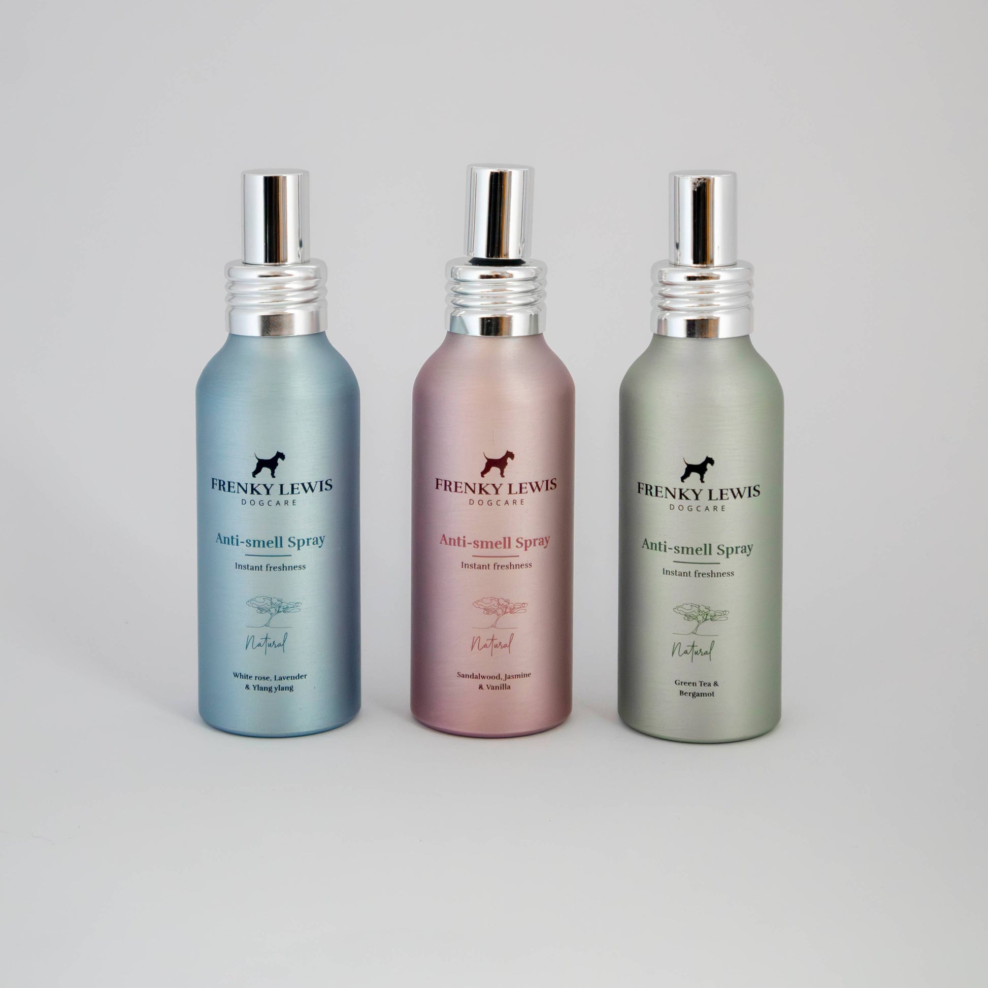 Three bottles of Franky Lewis body wash on a gray background