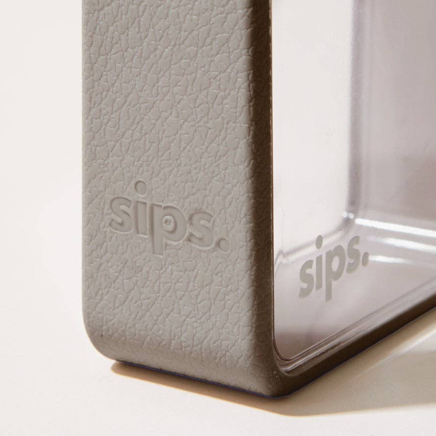 Sips 480ml BPA-free reusable water bottle with soft-touch bumper and carry strap.