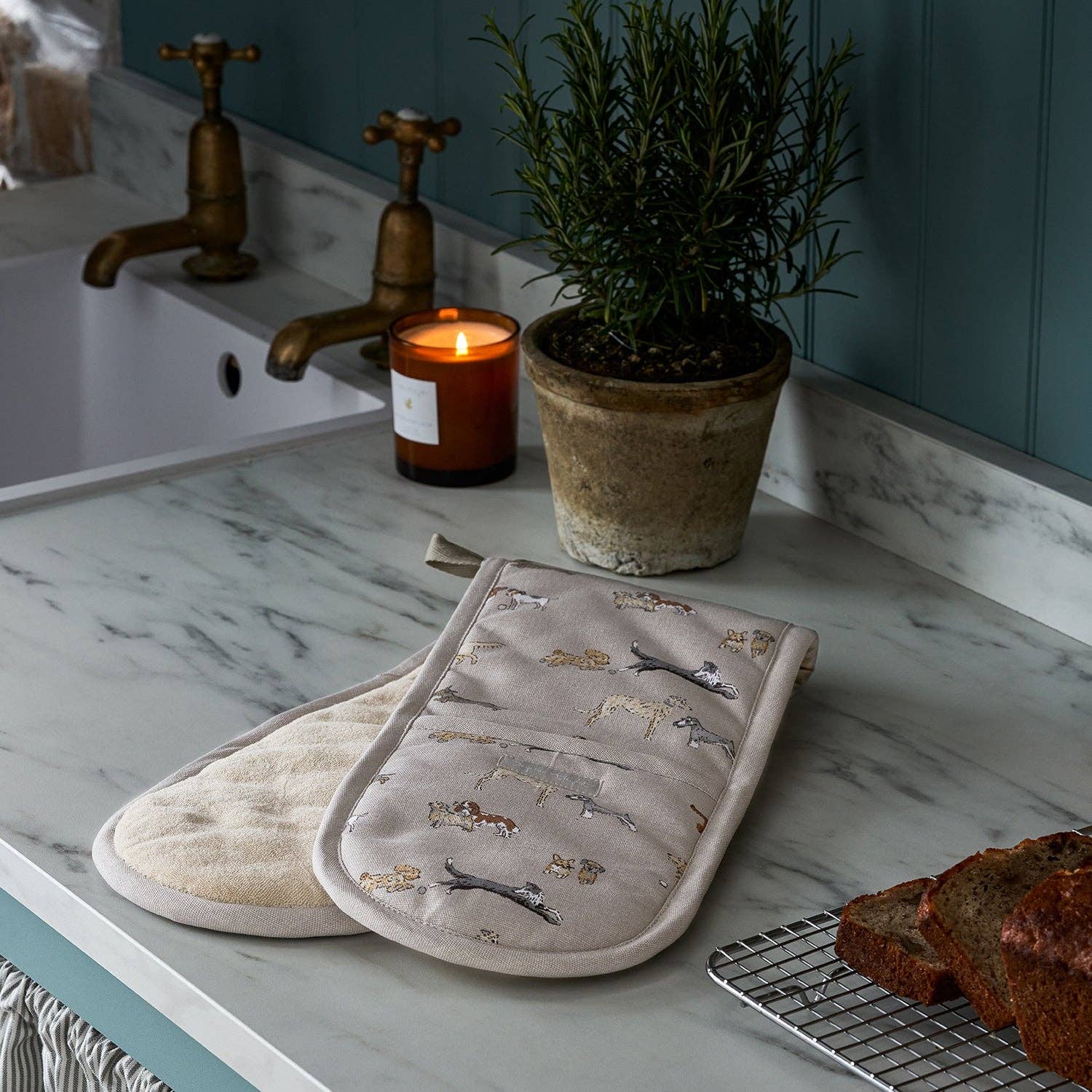 Sophie Allport Doggy Daycare double oven glove featuring playful illustrated dog breeds.