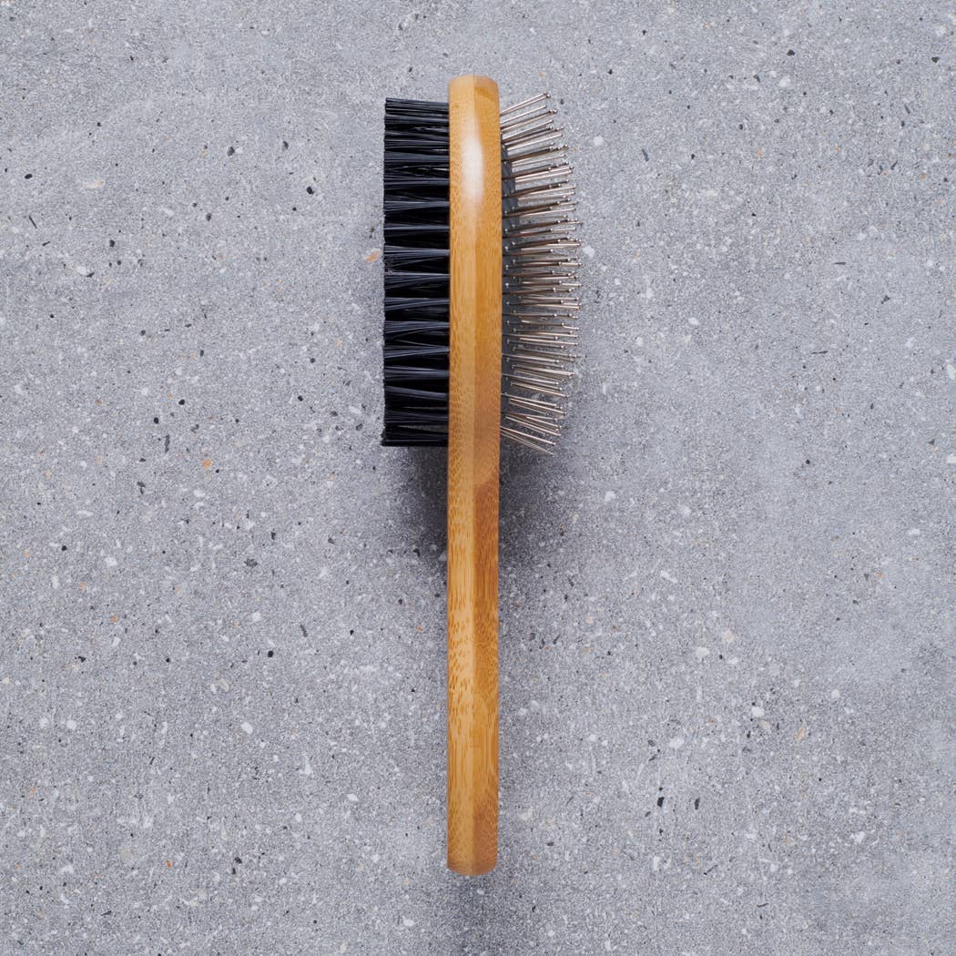 Dog being groomed with the Sweet William Bamboo Double Sided Dog Brush