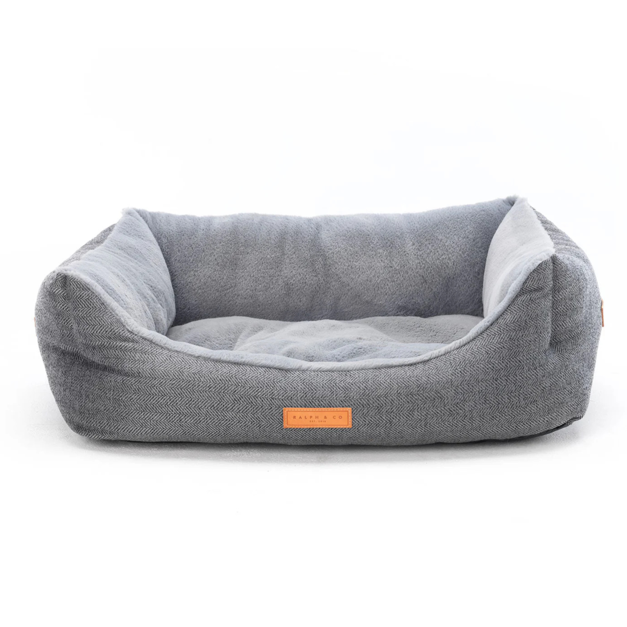 Gray pet bed with a brand label on a white background
