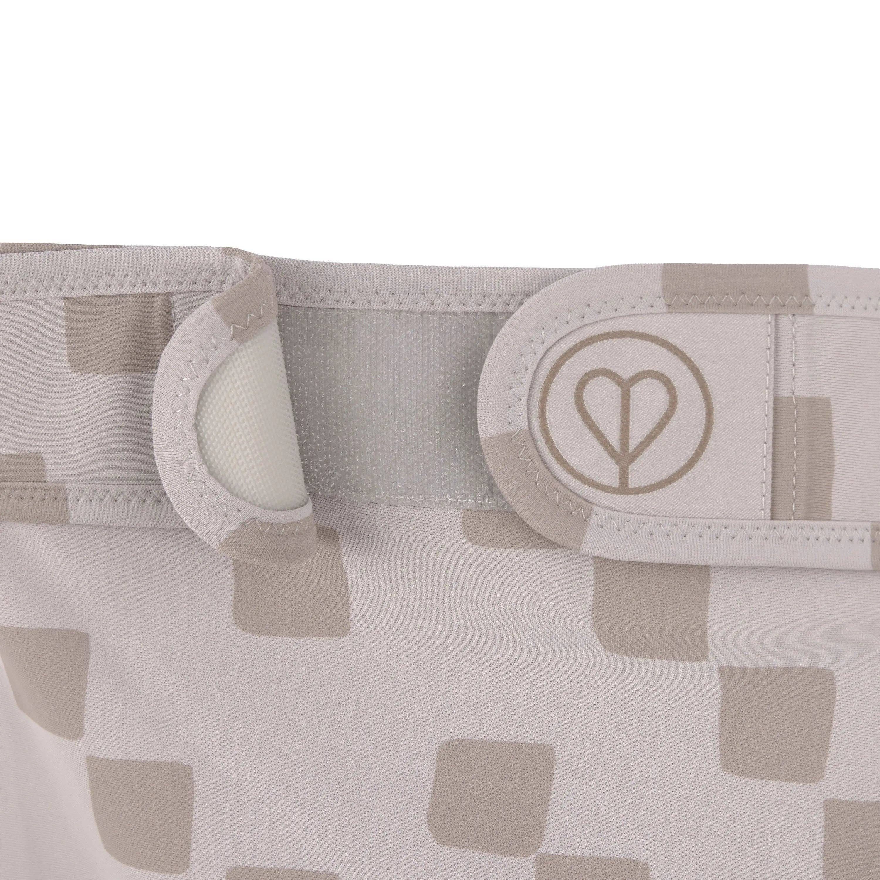 Taupe dog diaper made from recycled materials with soft absorbent lining and comfortable fit.