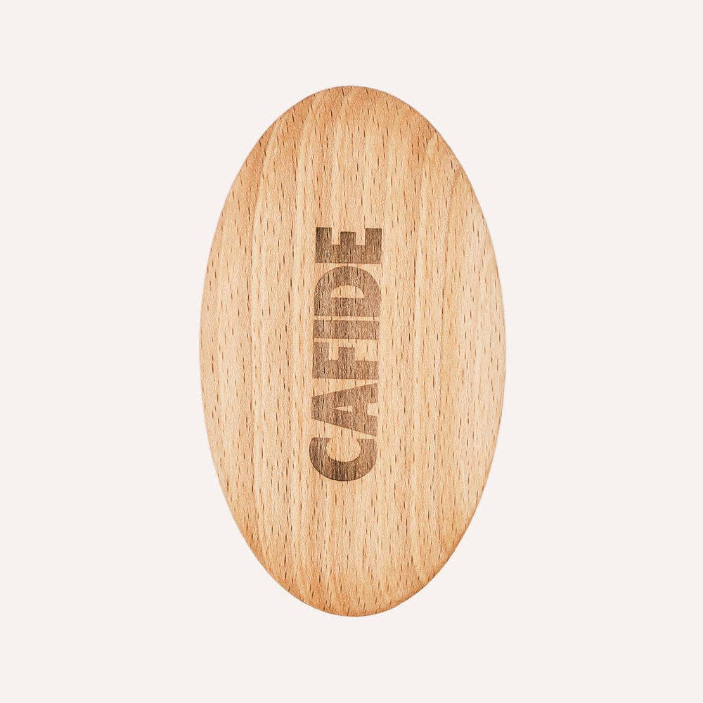 Ergonomic beech wood dog brush for maintaining healthy short coats.