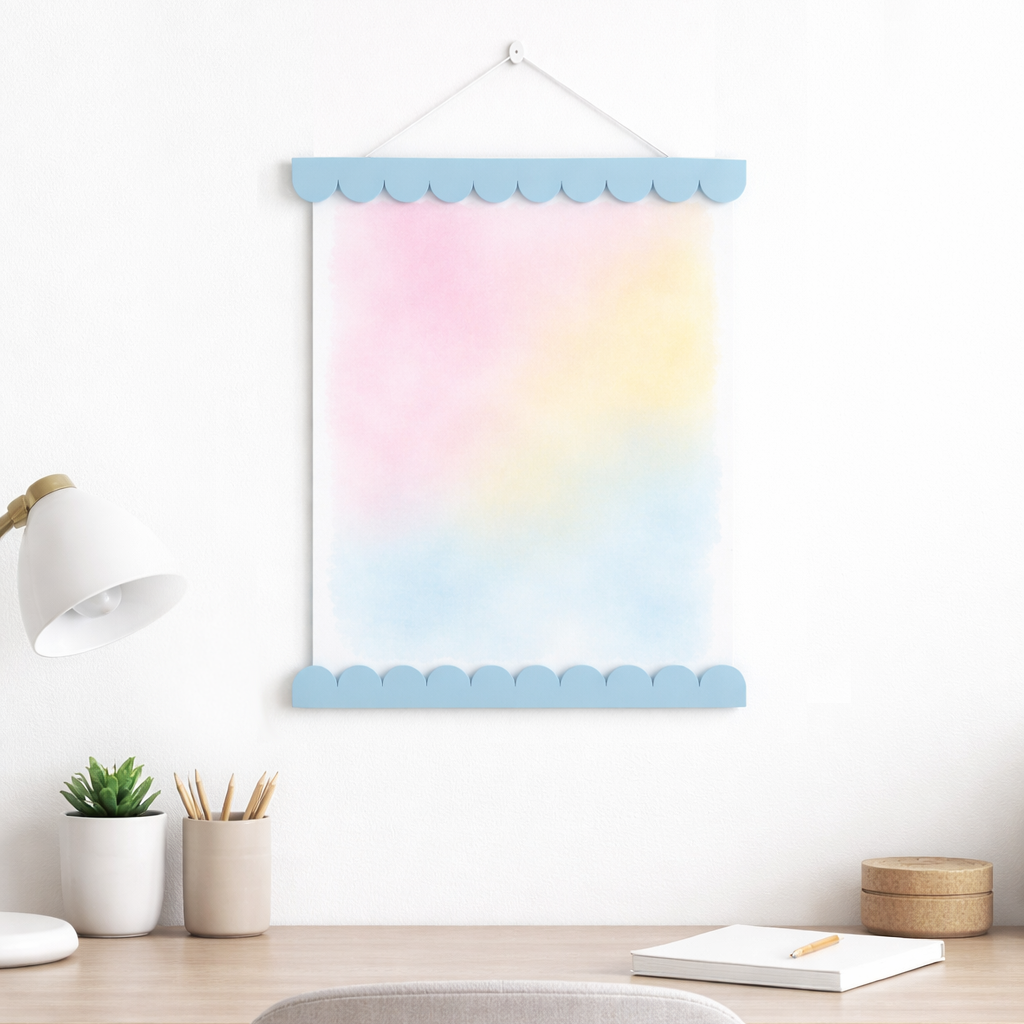 Pastel gradient wall chart with scalloped edges hanging on a wall in a room.