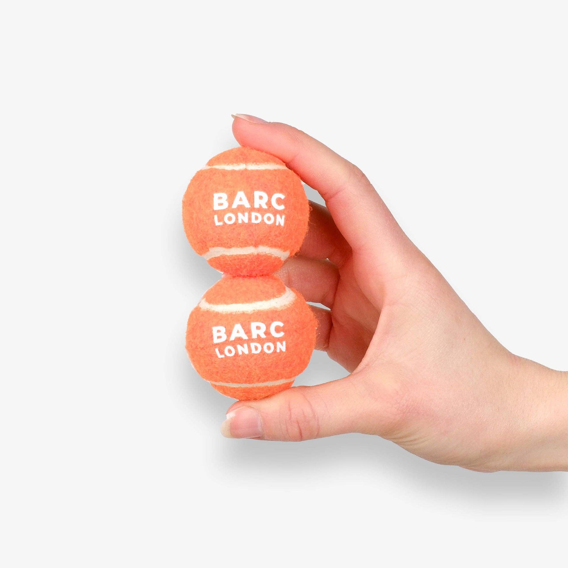 Close-up of the Bright Orange Mini Dog Ball set by Barc London