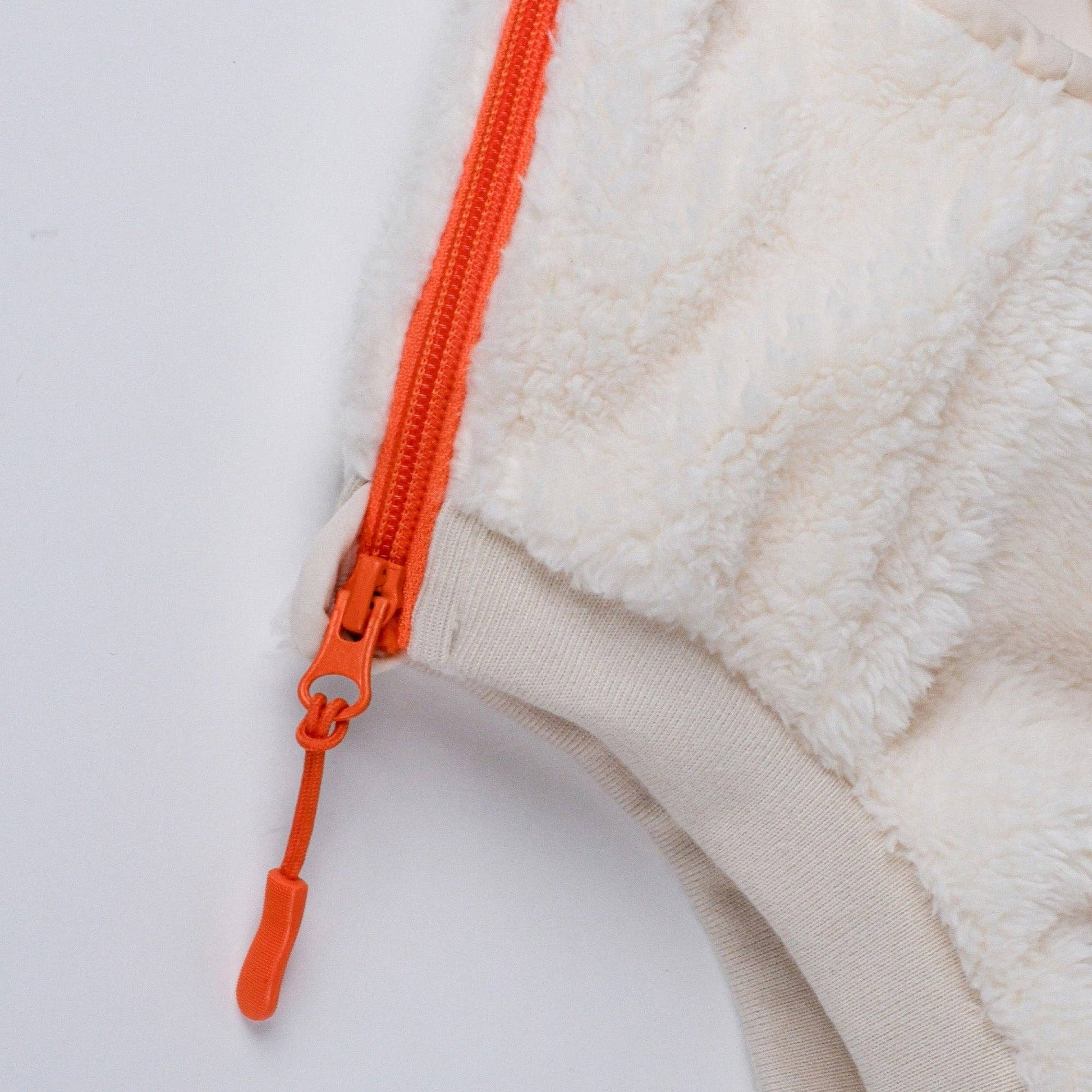 Dog wearing the Cream Sherpa Fleece Dog Vest outdoors