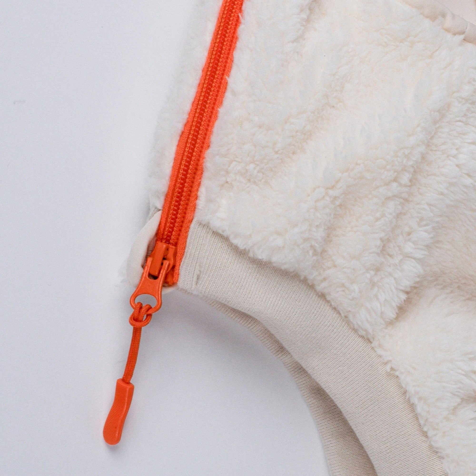 Dog wearing the Cream Sherpa Fleece Dog Vest outdoors