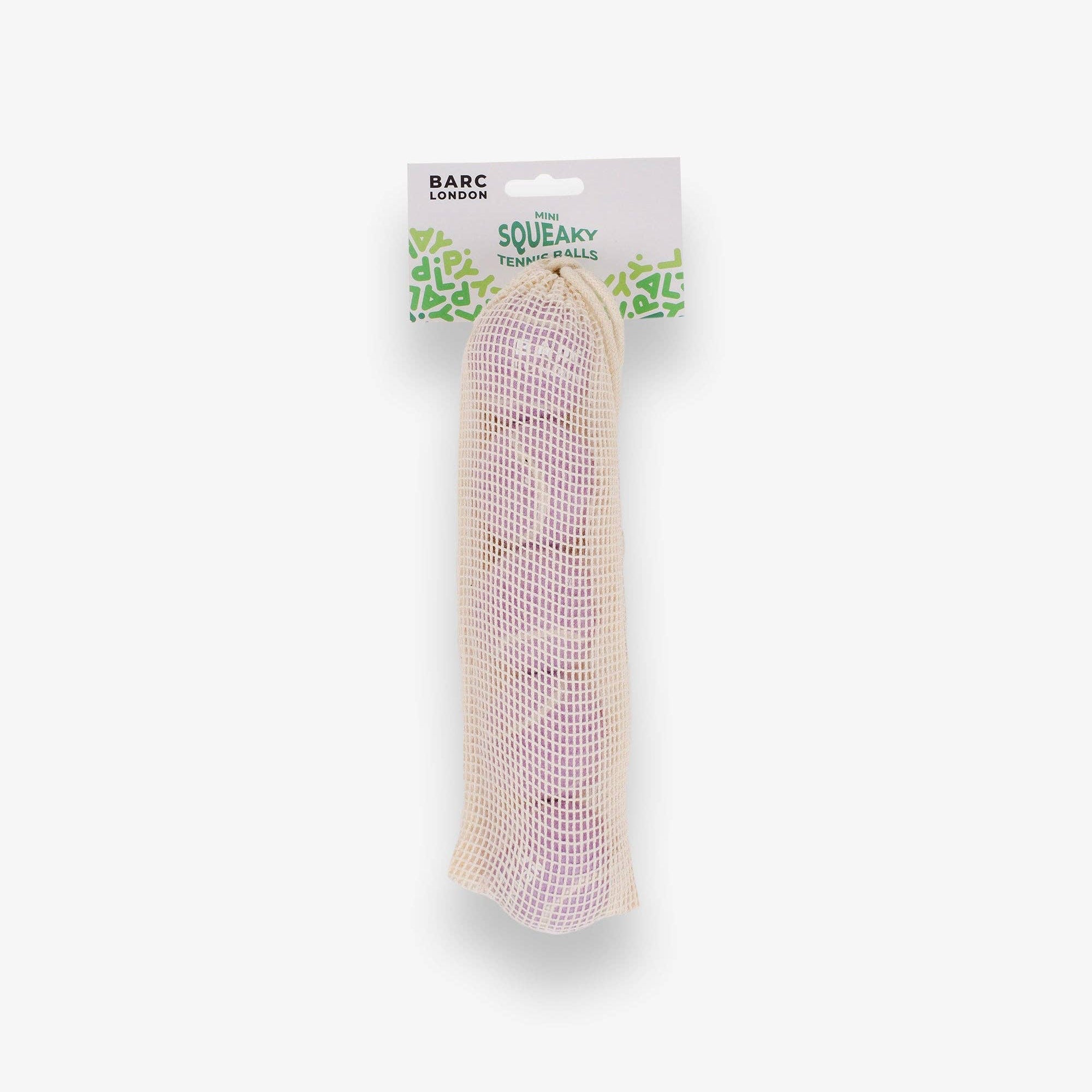 Lilac Mini Dog Balls stored inside the Barc London net bag