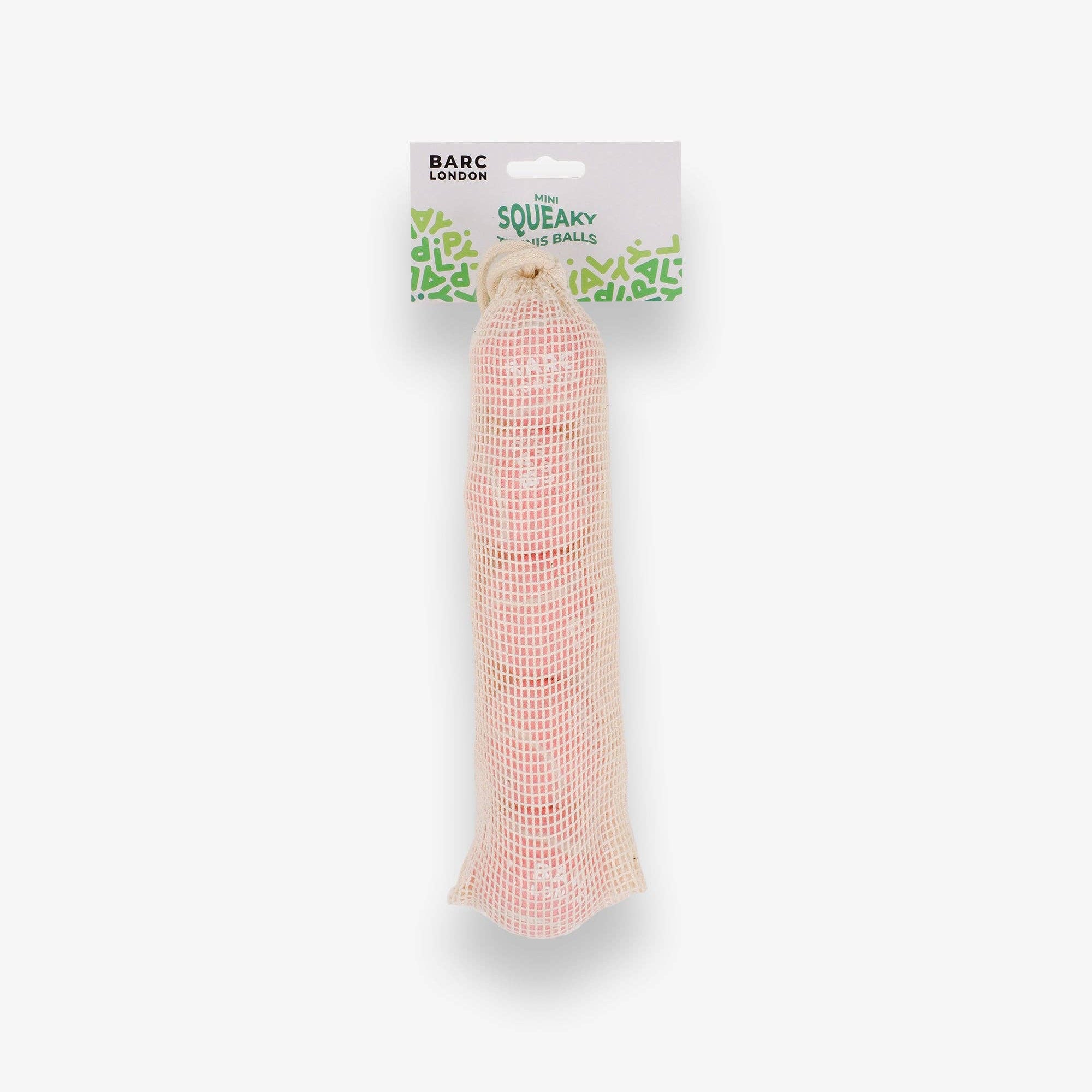 Pink Mini Dog Balls stored inside the Barc London net bag