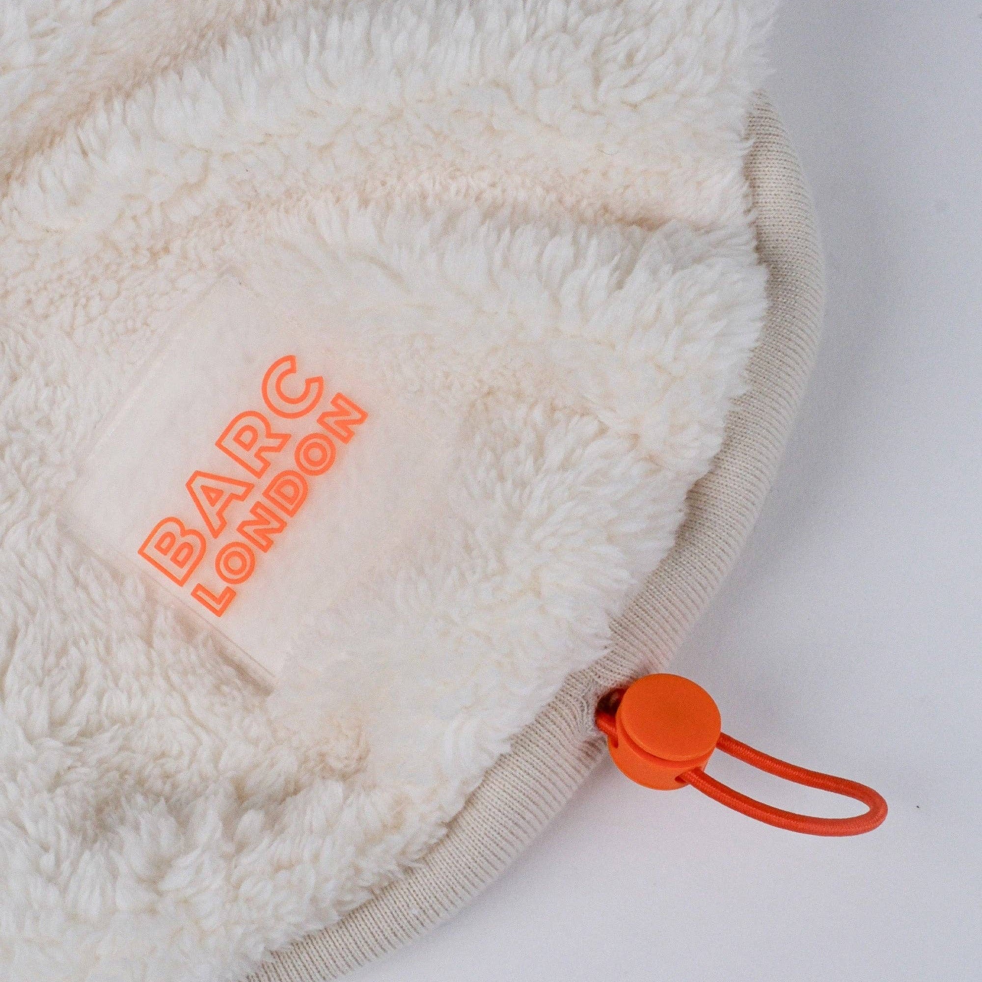 Close-up of the sherpa fleece texture on the Cream Dog Vest