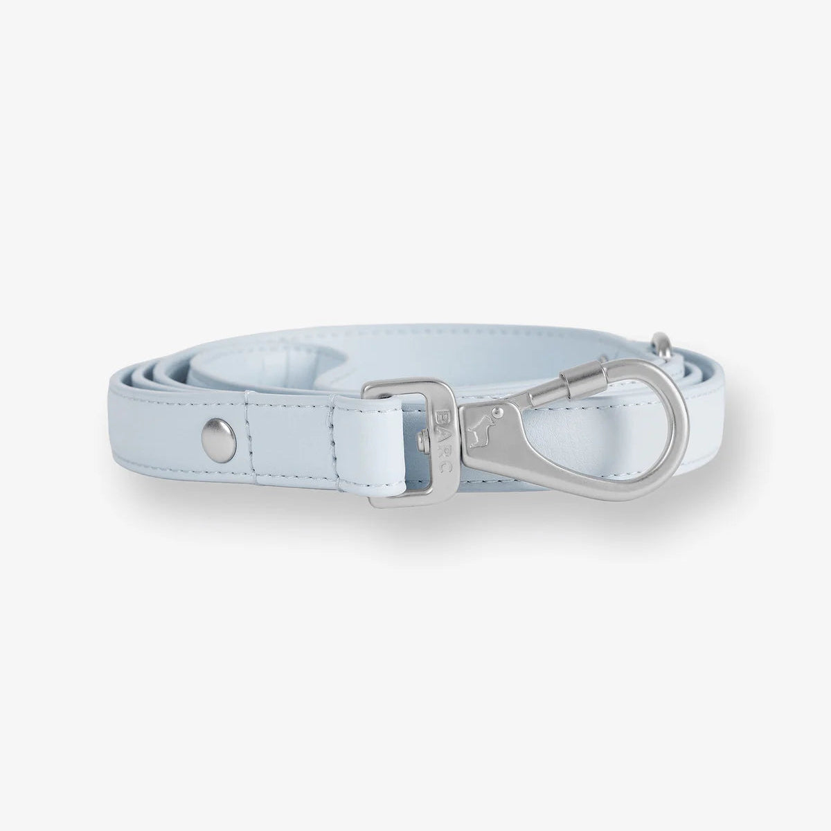 Light blue leather dog collar with silver hardware on a white background