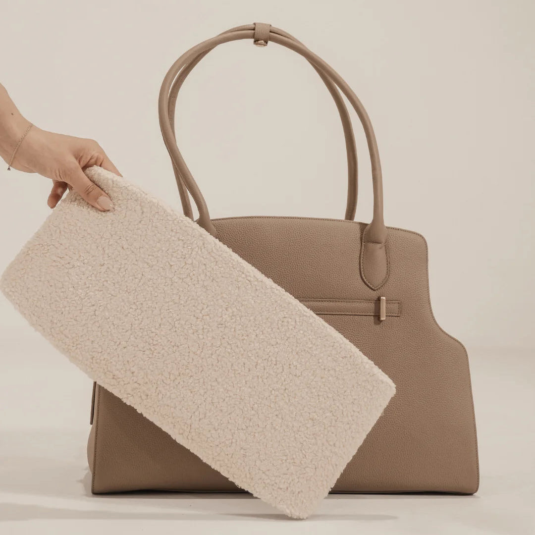 Canvas-lined interior and sherpa mat inside the Hazelnut Studio Carrier