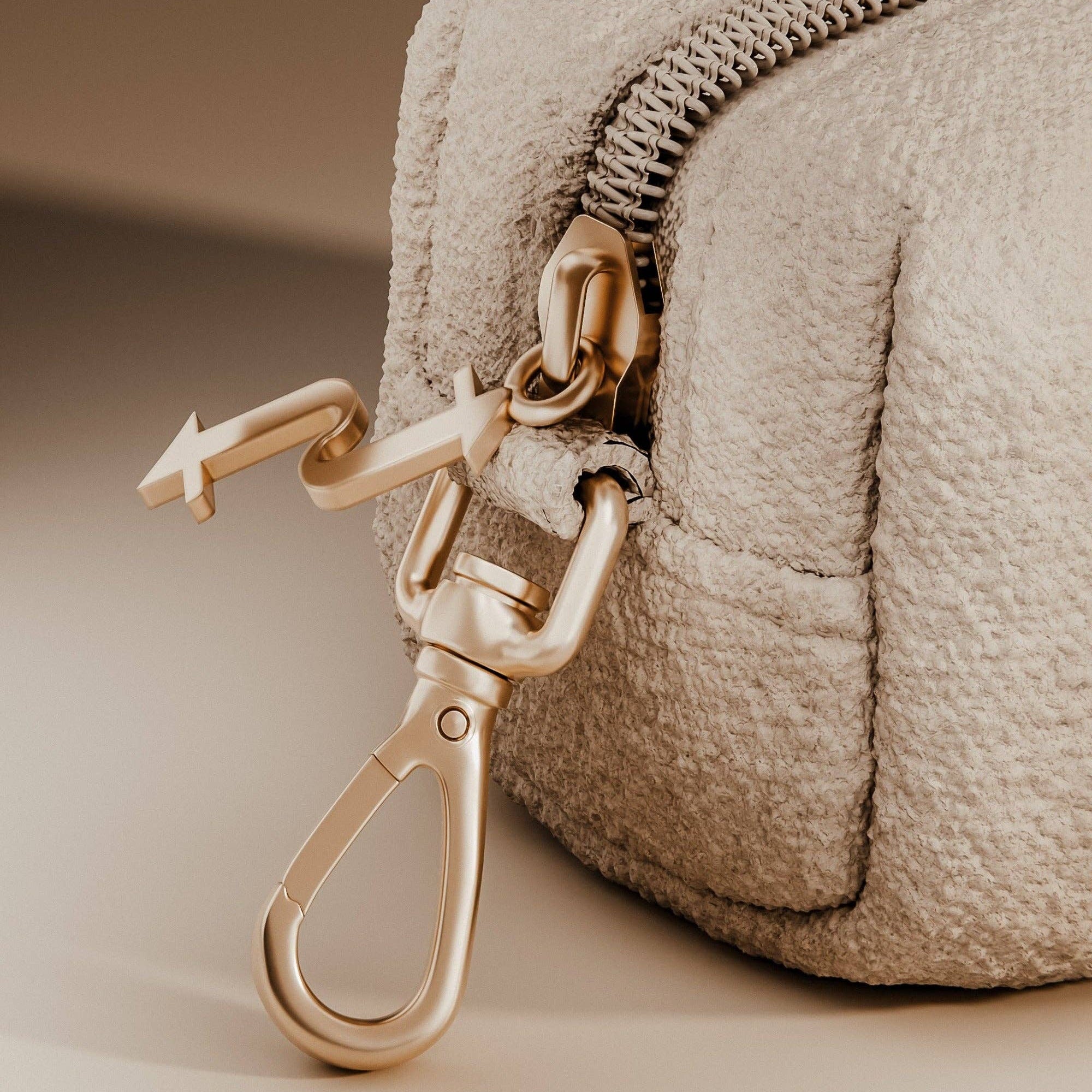Matte gold hardware detail on the Marshmallow Holder