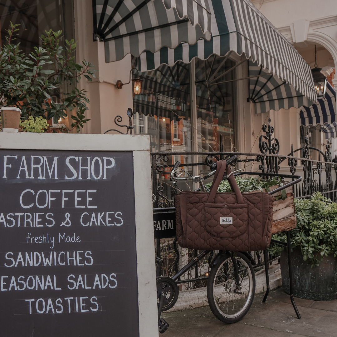 Farm shop with a bicycle and striped awning