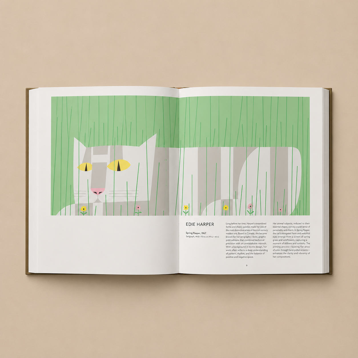 Open book with an illustration of a cat in grass on a beige background