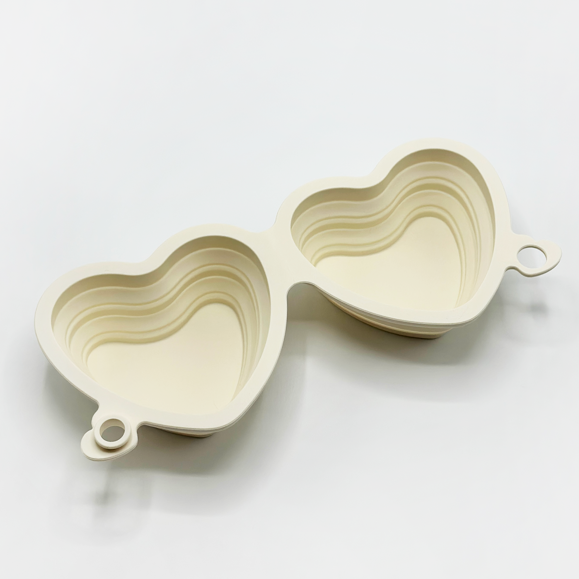 Folded Heart Collapsible Bowl in Cream with clip attachment