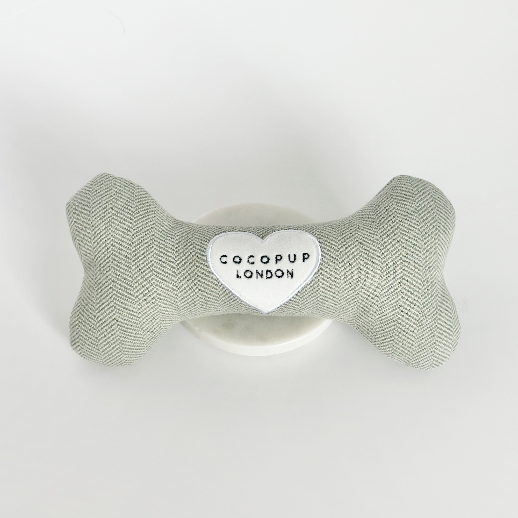 Soft plush Sage Tweed Bone Toy by Cocopup London
