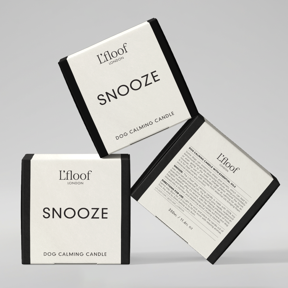 Two boxes of 'Elloof Snooze' dog calming candle on a gray background