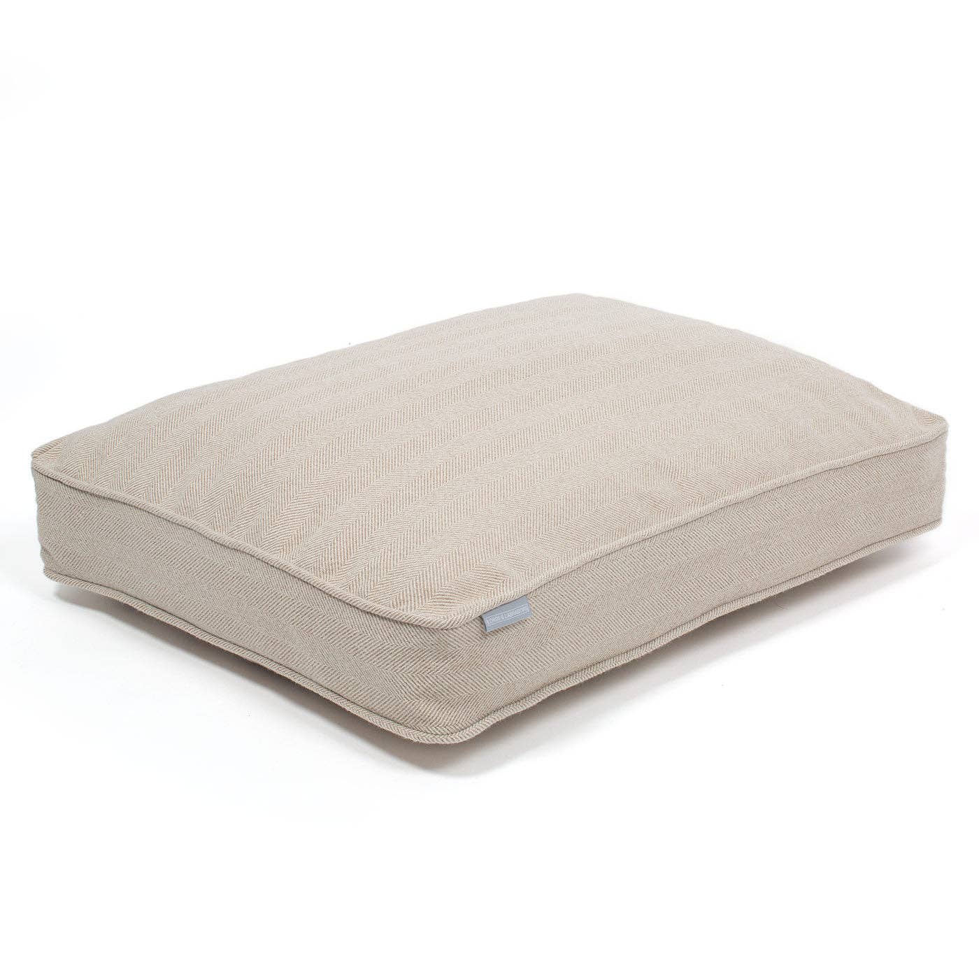 Beige pet bed with a small logo on a white background