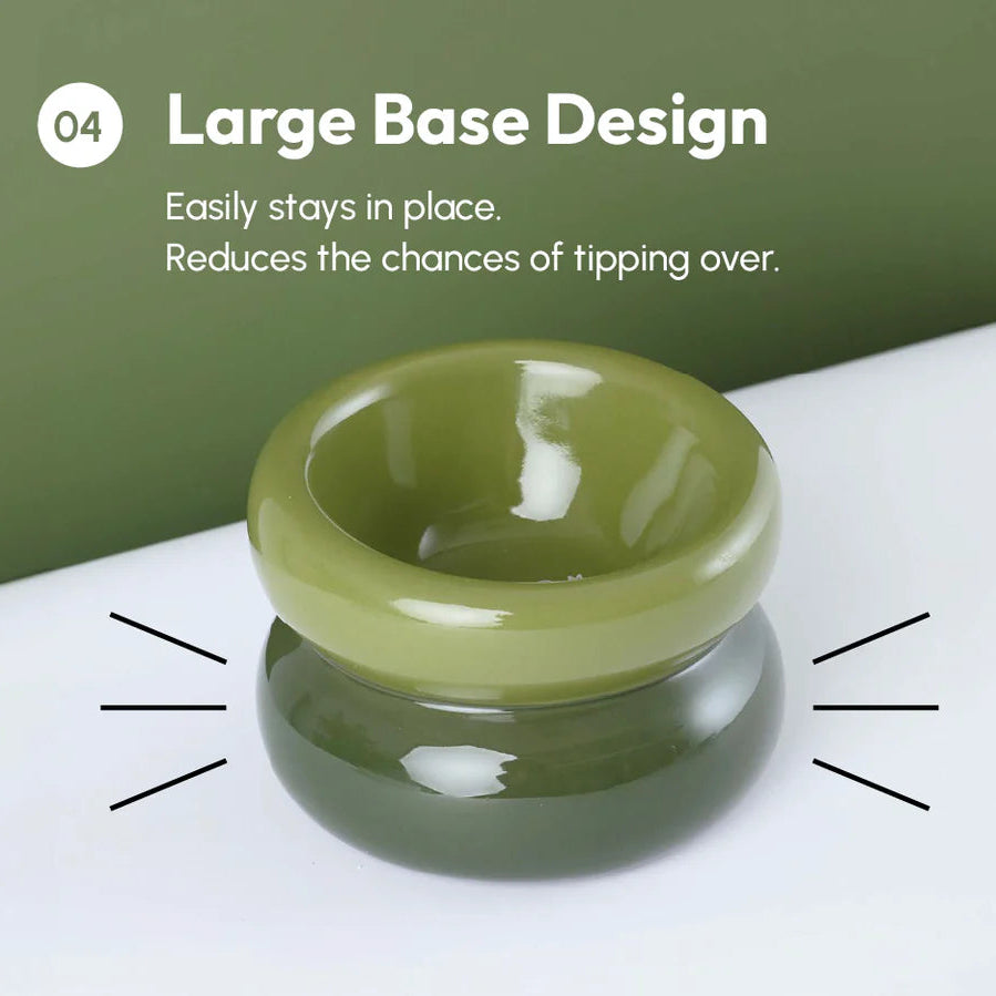 Green bowl with large base design on a white surface with green background