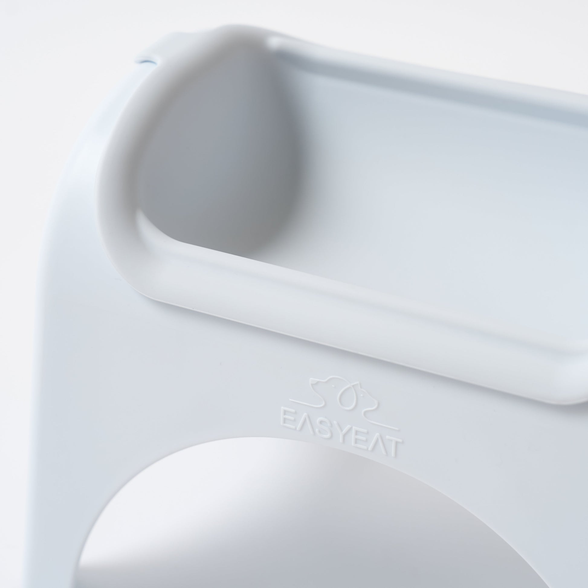 Close-up of a white electronic device with 'EASYEAT' branding on a light gray background