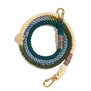 Colorful braided rope leash with gold hardware on a white background
