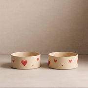 Dog eating from the Egg Back Home Cozy Hearts Stoneware Pet Bowl Set of 2