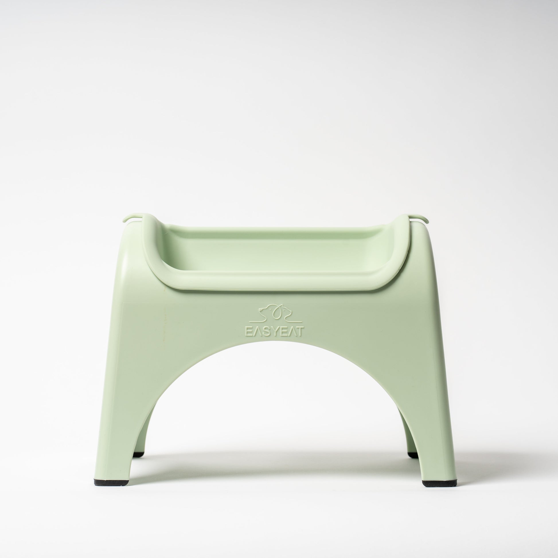 Light green plastic chair on a white background