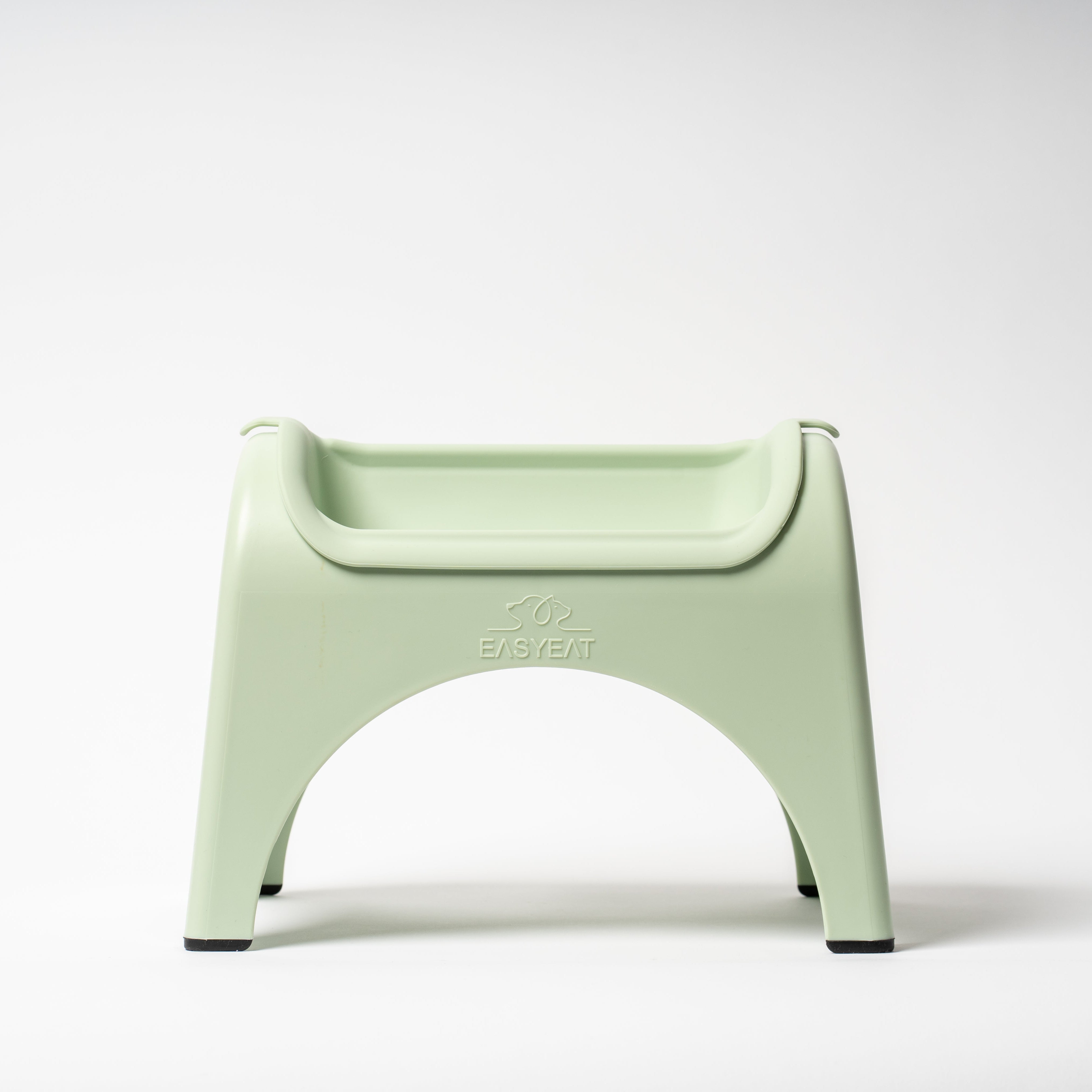Light green plastic chair on a white background