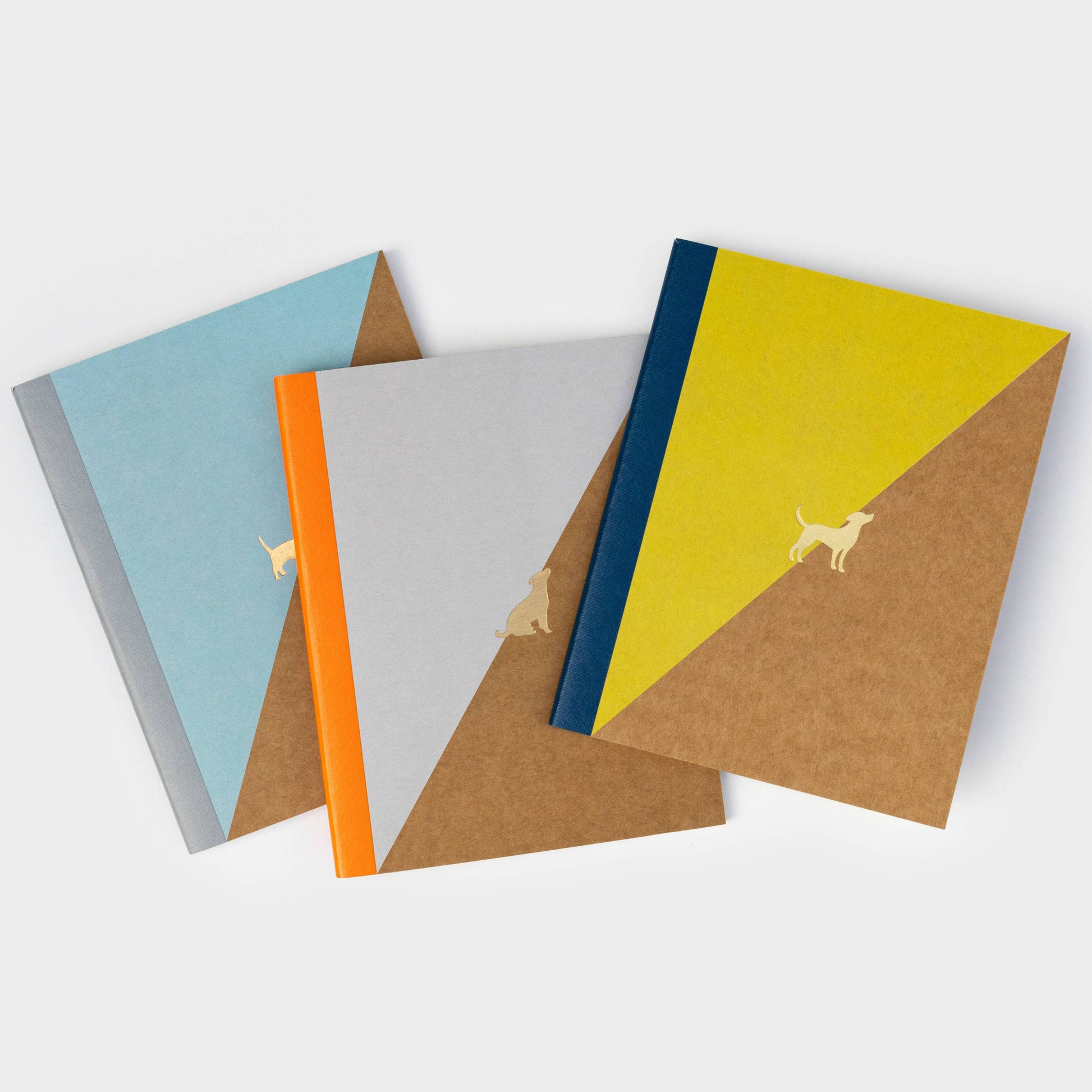 Set of four colorful notebooks on a light gray background - bell & beau 