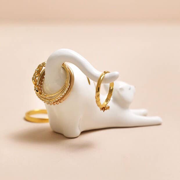 Ceramic cat ring holder styled on a bedside table