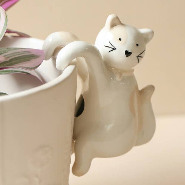 Ceramic Cat Planter Hanger by Lisa Angel on a plant pot