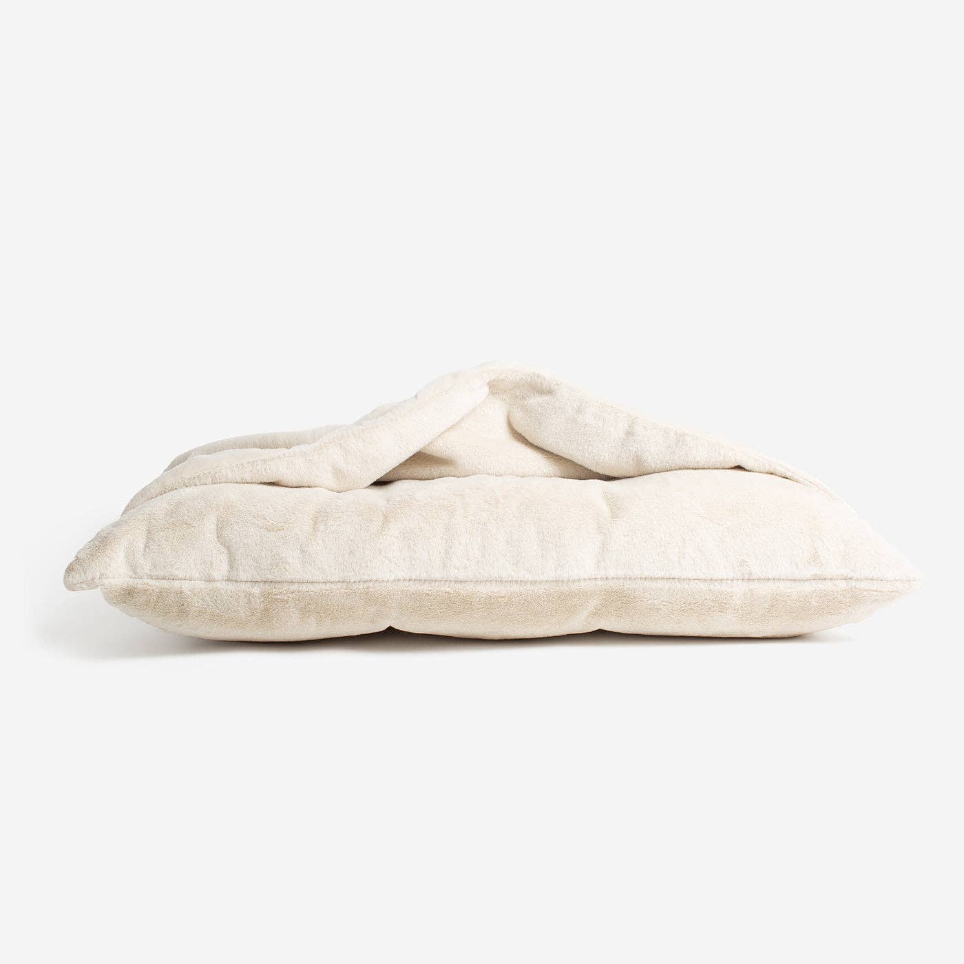 Sleepy Burrows Bed in Cream Faux Fur styled inside a dog crate
